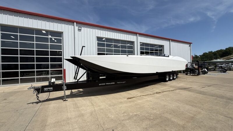 Front port-side perspective of a white 2013 MTI 42 R/P performance catamaran